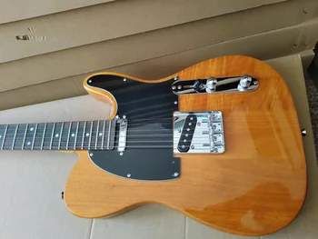 Raudonmedžio medienos elektrinė gitara, ekonomiškas, jaučiasi ir skamba puikiai.